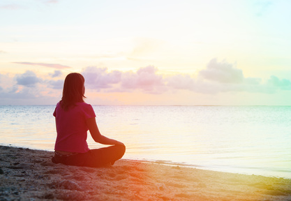woman meditation on the beach